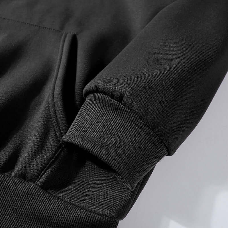 Detalle del puño y bolsillo del Art Retro Simple Ladies Hoodie Streetwear en color negro.